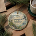 A decorative ornament featuring a scenic image of Niagara Falls State Park in New York, with a boat and waterfall in the background.