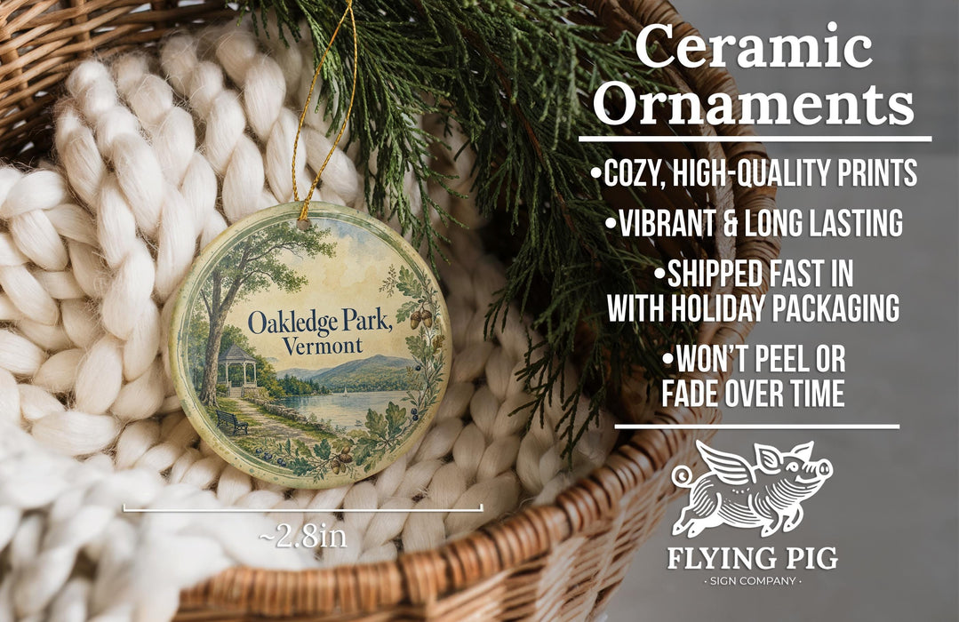 Ceramic ornaments, specifically Oakledge Park, Vermont ornaments, are displayed in a basket with pine branches. The text highlights the ornaments as "cozy, high-quality prints, vibrant and long lasting, shipped fast in with holiday packaging, won't peel or fade over time".