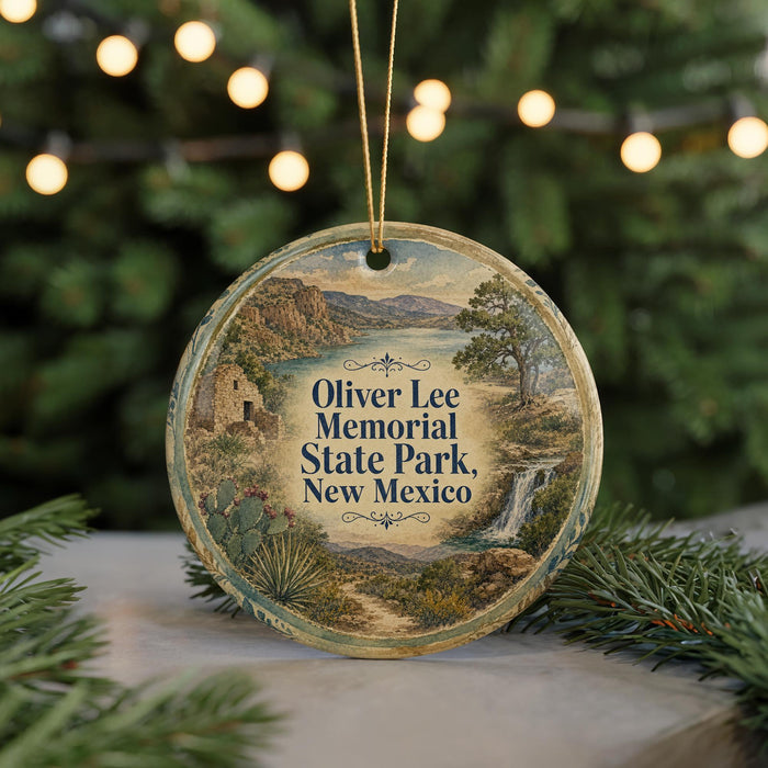 A circular ornament with a landscape scene and text, hanging on a string.