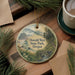A round ornament with a scenic landscape of Oswald West State Park, Oregon, featuring a bridge, mountains, and pine trees.