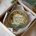 A circular ornament with a scenic image of the Ozark Caves at Lake of the Ozarks, located in State Park, Missouri.