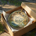 A circular ornament with a scenic image of Ozark Caves at Lake of the Ozarks, located in Missouri.