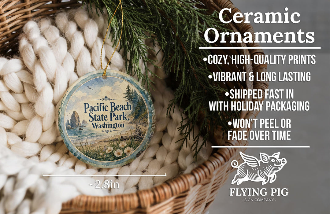 Ceramic ornaments, featuring a design of Pacific Beach State Park, Washington, with a wicker basket and greenery in the background.