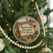 A circular ornament hanging on a Christmas tree, featuring a cowboy on horseback and the text "Pancho Villa State Park, New Mexico".
