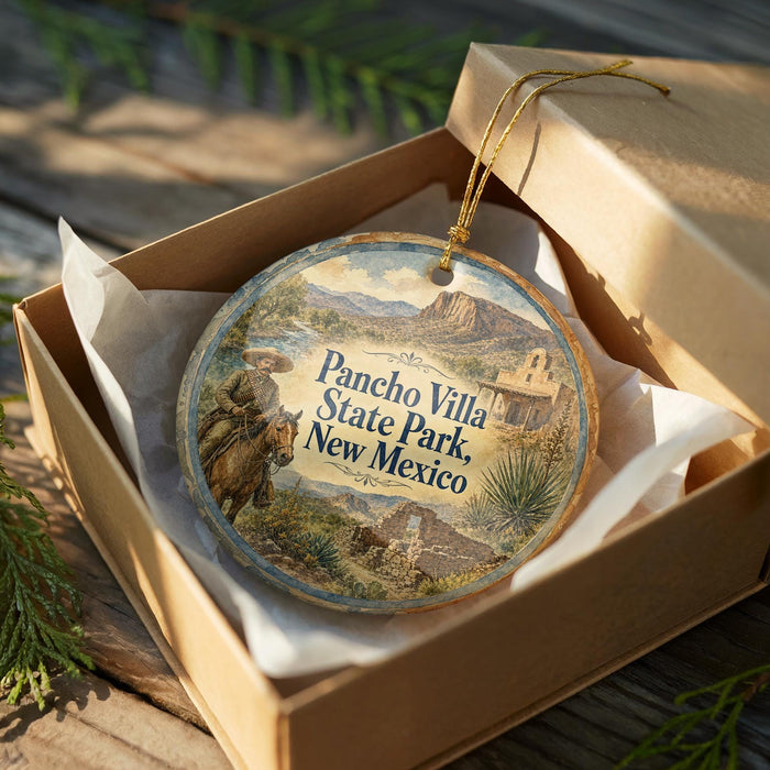 A decorative ornament in a wooden box, featuring a scenic image of a desert landscape with mountains and buildings.