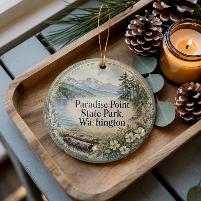 A decorative ornament with a scenic landscape of mountains, pine trees, and a lake, featuring the text "Paradise Point State Park, Washington".