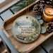 A decorative ornament with a scenic landscape of mountains, pine trees, and a lake, featuring the text "Paradise Point State Park, Washington".