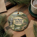 A decorative ornament featuring a scenic landscape of Paris Mountain State Park, South Carolina, with a waterfall and pine trees.