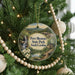 A Christmas tree decorated with ornaments, including a circular ornament with a scenic image of Paris Mountain State Park, South Carolina.