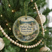A round ornament hanging on a Christmas tree, featuring a scenic image of the park and a text that reads "Parker Dam State Park, Pennsylvania".