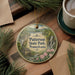 A decorative ornament featuring a scenic image of Paterson State Park, Pennsylvania, with a small house and waterfall in the background.