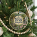 A circular ornament hanging on a Christmas tree, featuring a scenic image of Paterson State Park, Pennsylvania.