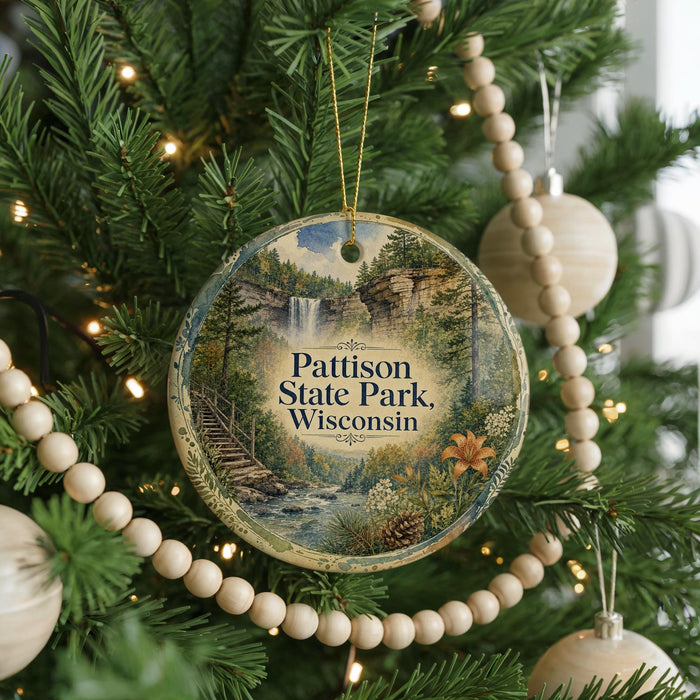 A round ornament on a Christmas tree, featuring a scenic image of Patison State Park, Wisconsin.