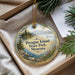 A decorative ornament with a scenic landscape of Pirogue Island, Montana, featuring a lake, mountains, and pine trees.