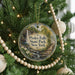 A round ornament on a Christmas tree, featuring a scenic image of Pixley Falls State Park in New York.