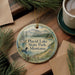 A decorative ornament featuring a scenic image of Placid Lake State Park, Montana, with pine trees and a lake in the background.