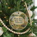 A round ornament hanging on a Christmas tree, featuring a scenic image of Platte River State Park, Nebraska.