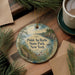 A decorative ornament with a scenic landscape of Pointauro State Park, New York, featuring a body of water, trees, and a bridge.