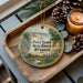 A wooden tray with a decorative ornament featuring a scenic landscape of Point Beach State Forest, Wisconsin, and pine cones.