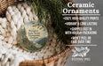 Ceramic ornaments, featuring a scenic landscape, are displayed in a woven basket.