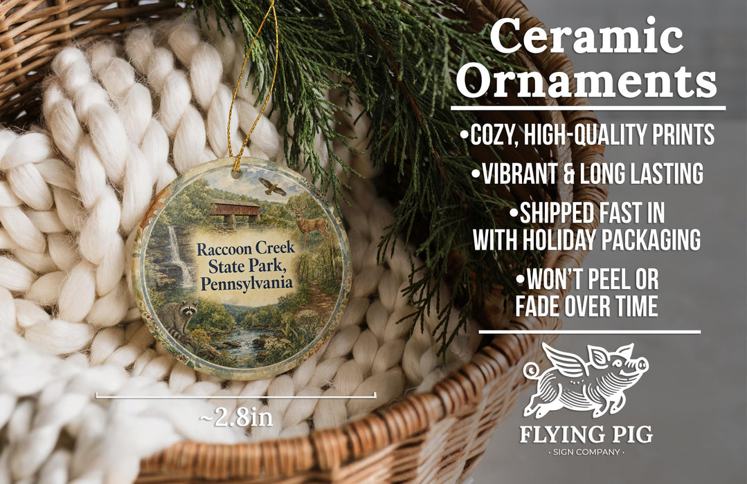 Ceramic ornaments, featuring a detailed image of Racoon Creek State Park, Pennsylvania, hanging from a wicker basket.