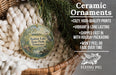 Ceramic ornaments, featuring a bird and a landscape scene, are displayed in a basket with greenery.