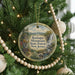 A round ornament hanging on a Christmas tree, featuring a scenic image of Ramapo Mountain State Forest in New Jersey.
