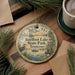 A round ornament with a scenic image of Reelfoot Lake State Park, Tennessee, featuring a heron, a boat, and a sunset over the lake.