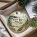 A decorative ornament with a scenic image of Robert Moses State Park in New York, featuring a lighthouse and a bridge, is displayed in a box with pine branches.