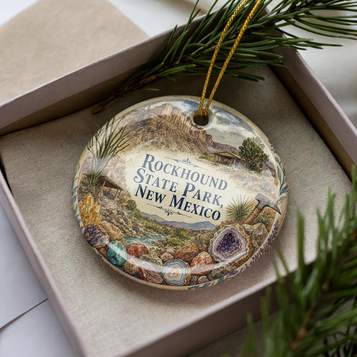 A decorative ornament in a box, featuring a scenic image of the Rockhound State Park in New Mexico.
