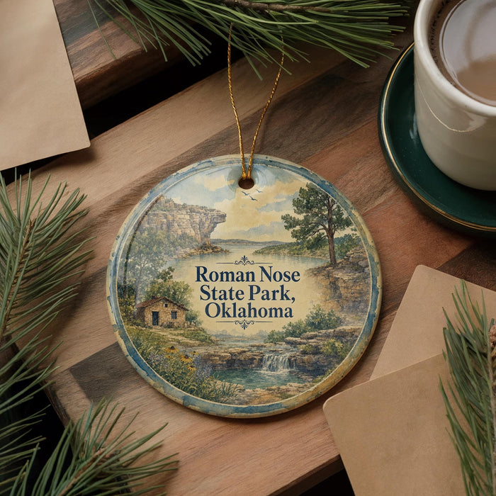 A decorative ornament featuring a scenic landscape of Roman Nose State Park, Oklahoma, with pine trees and a waterfall.