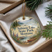 A decorative ornament with a scenic landscape of Salmon Lake State Park, Montana, featuring a lake, mountains, pine trees, and a canoe.
