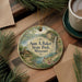 A decorative ornament with a scenic landscape of Sam A. Baker State Park, Missouri, featuring a waterfall and pine trees.