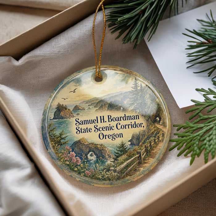 A decorative ornament with a scenic landscape of mountains, forests, and a winding path, hanging from a string.