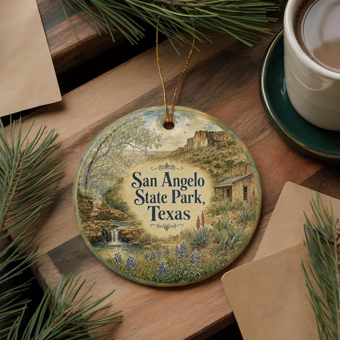 A decorative ornament featuring a scenic landscape of San Angelo State Park, Texas, with a waterfall and desert scenery.