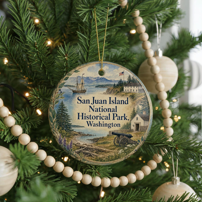 A round ornament hanging on a Christmas tree, featuring a scenic image of San Juan Island National Historical Park in Washington.