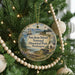 A round ornament hanging on a Christmas tree, featuring a scenic image of San Juan Island National Historical Park in Washington.