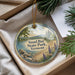 A round ornament with a scenic image of Sand Bar State Park, Vermont, hanging from a string.