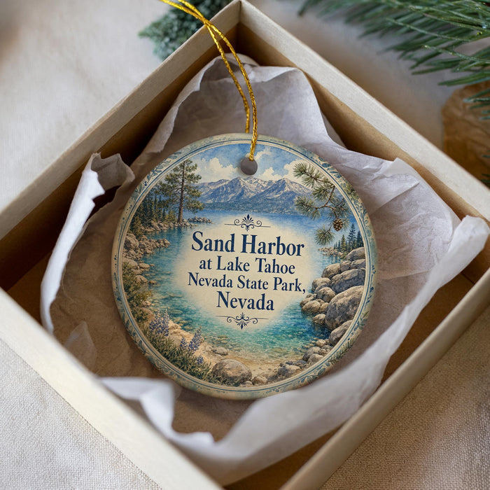 A decorative ornament in a box, featuring a scenic image of Sand Harbor at Lake Tahoe, Nevada State Park, Nevada.