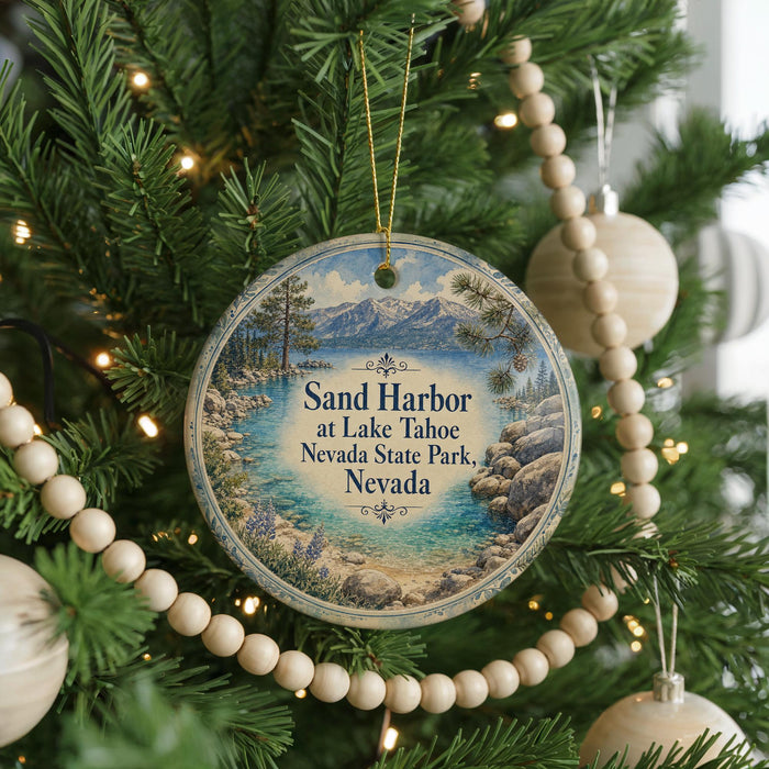 A round ornament hanging on a Christmas tree, featuring a scenic image of Lake Tahoe and Nevada State Park.