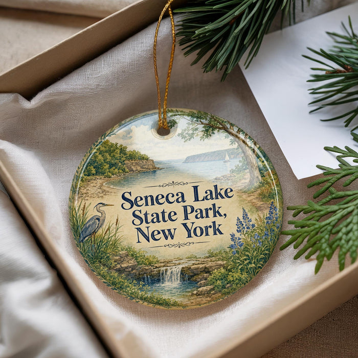 A decorative ornament with a scenic landscape of Seneca Lake, State Park, New York, featuring a bird, water, and greenery.