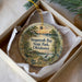 A decorative ornament in a box, featuring a scenic image of Sequoyah Bay State Park, Oklahoma.