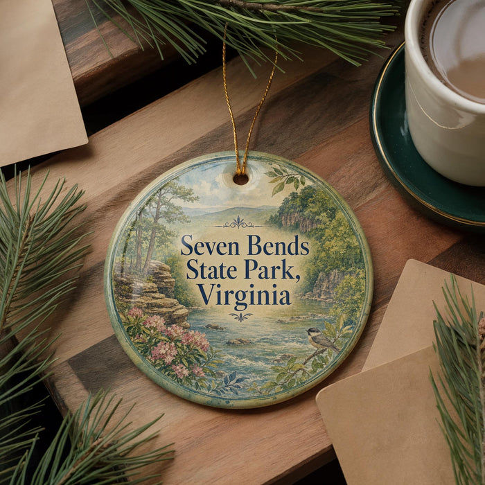 A decorative ornament with the text "Seven Bends State Park, Virginia" is displayed on a wooden surface, surrounded by pine branches and a cup of coffee.