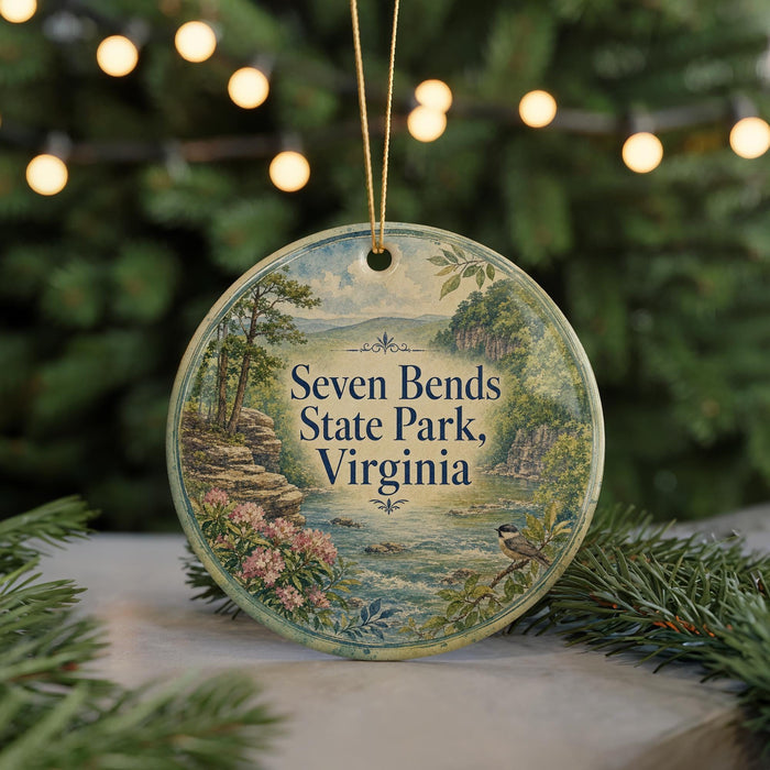 A circular ornament with a scenic landscape of Seven Bends State Park, Virginia, featuring a bird perched on a branch and surrounded by trees and water.