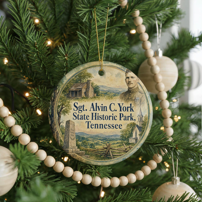 A round ornament hanging on a Christmas tree, featuring a portrait of a man and the text "Sgt. Alvin C. York State Historic Park, Tennessee".