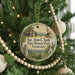 A round ornament hanging on a Christmas tree, featuring a portrait of a man and the text "Sgt. Alvin C. York State Historic Park, Tennessee".