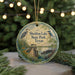 A round ornament with a scenic image of Sheldon Lake State Park, Texas, featuring a bird, a bridge, and a body of water.