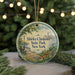 A round ornament with a scenic view of Shirley Chisholm State Park in New York, featuring a park bench, a lamppost, and a city skyline.