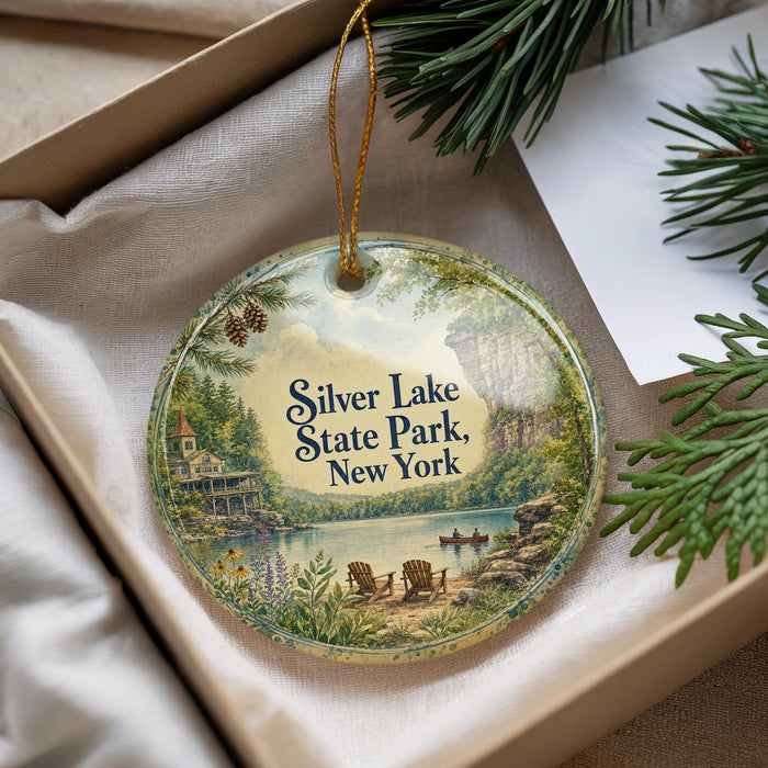 A decorative ornament with a scenic image of Silver Lake State Park, New York, hanging from a string.