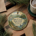 A round ornament with a scenic image of Silver Lake State Park, Vermont, hanging on a wooden surface.